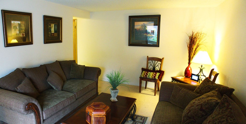 a living room with couches and a coffee table