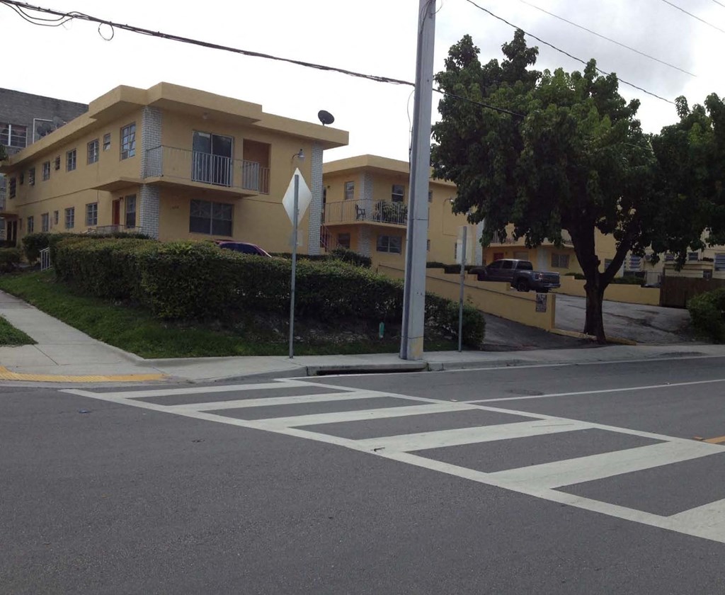 a crosswalk at an empty intersection in an apartment building