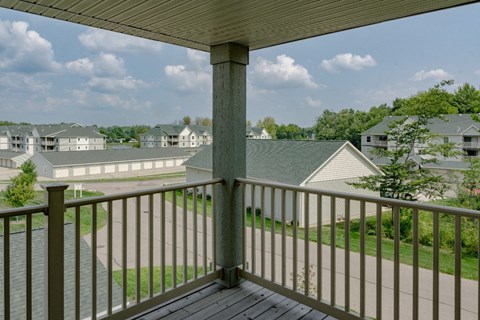 the view from the deck of a home with a porch