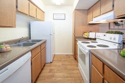 a kitchen with a stove and a refrigerator