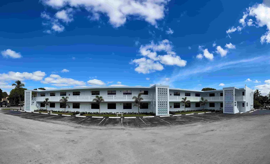 an empty parking lot in front of an office building