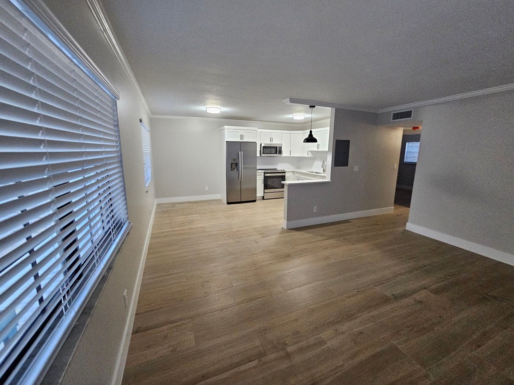 a view of a living room and kitchen from the window