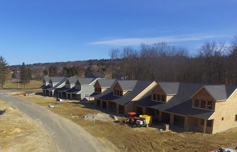 a group of new houses being constructed in a subdivision