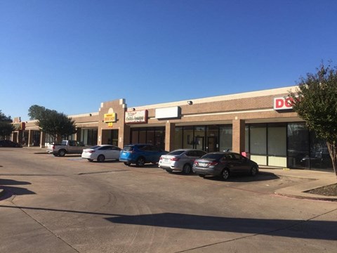 A Dollar General store is shown with a parking lot in front.
