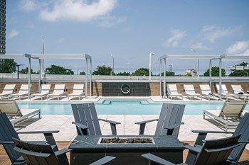 Quarter residents enjoy a heated zero-edge pool with cabanas and grills on a raised deck - Photo Gallery 9