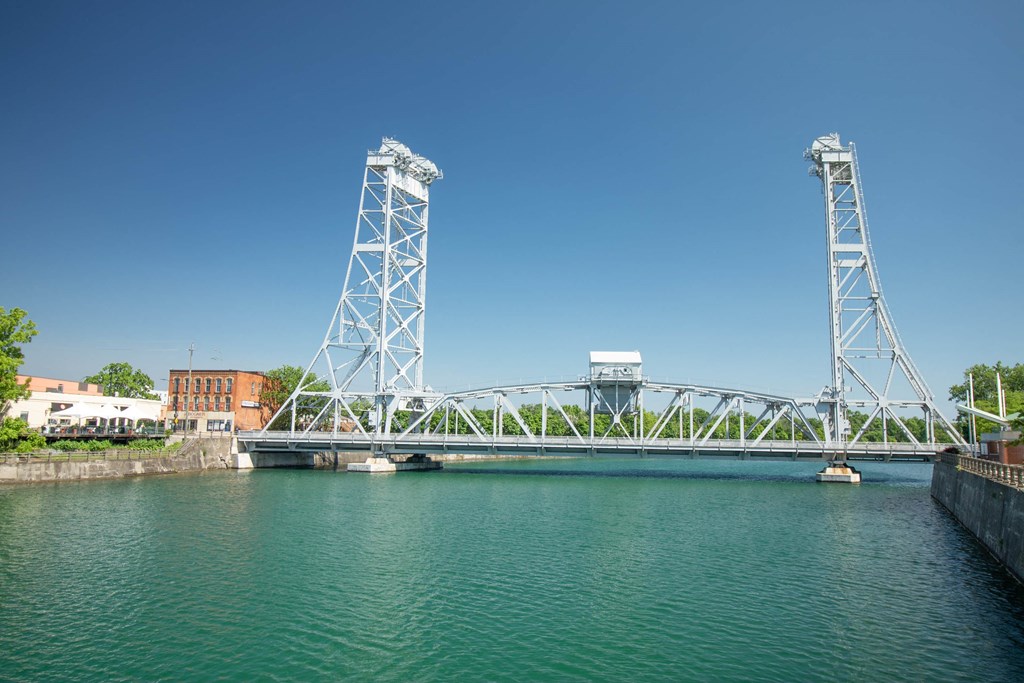 a bridge over a body of water with a boat