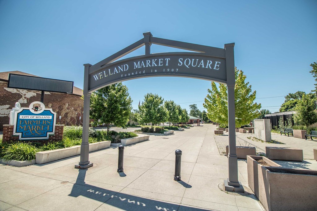 the welcome sign at the entrance to welland market square