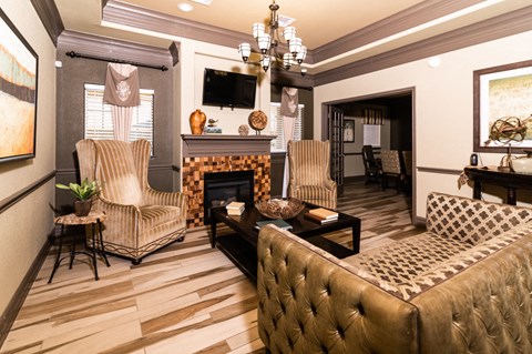 A living room with a fireplace and a couch.