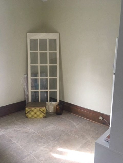 a room with a chair and a window in it