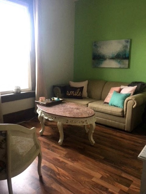 a living room with a couch and a table