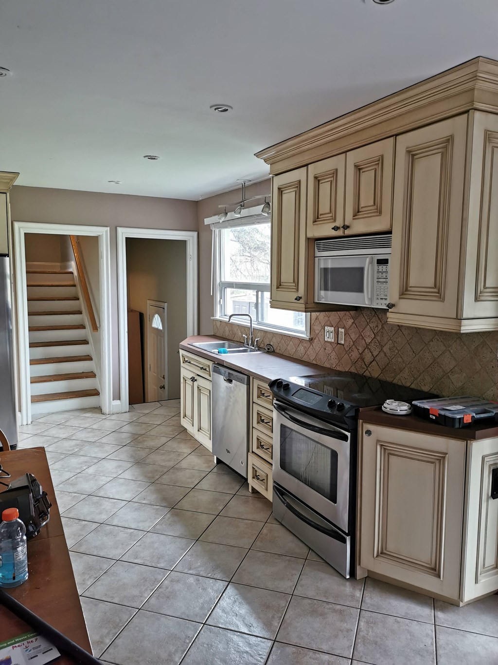 a kitchen with a stove and a microwave
