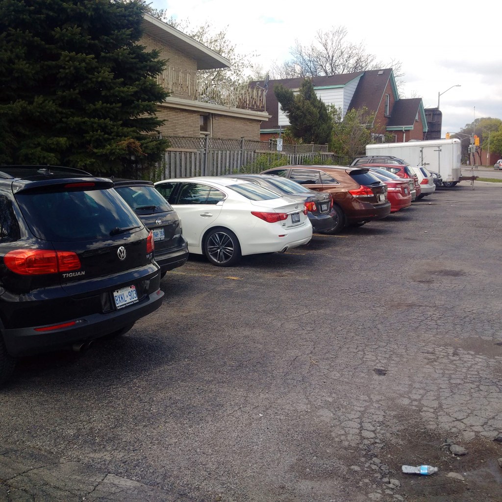 a row of cars parked in a parking lot