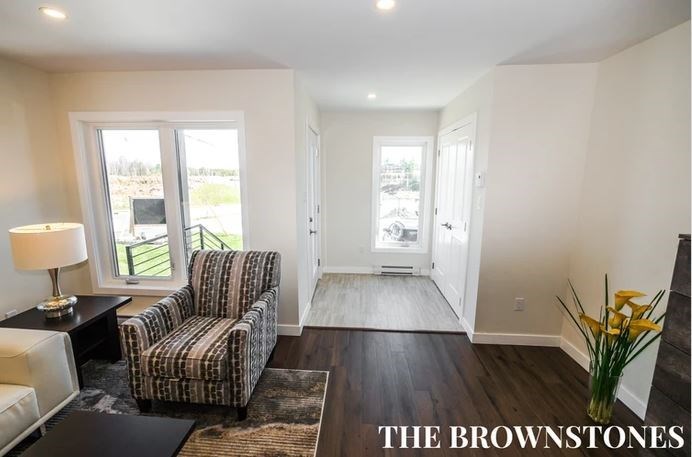 a living room with a couch and a chair