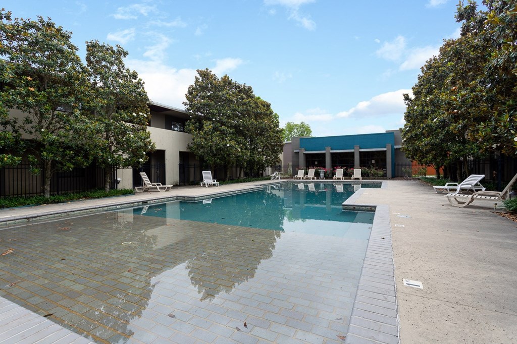 a swimming pool in front of a building