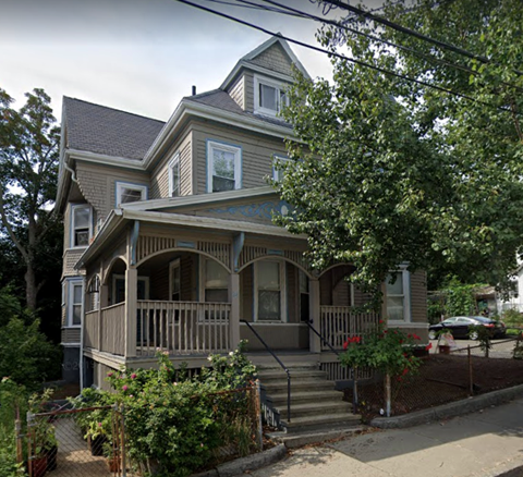 a house with a porch and stairs