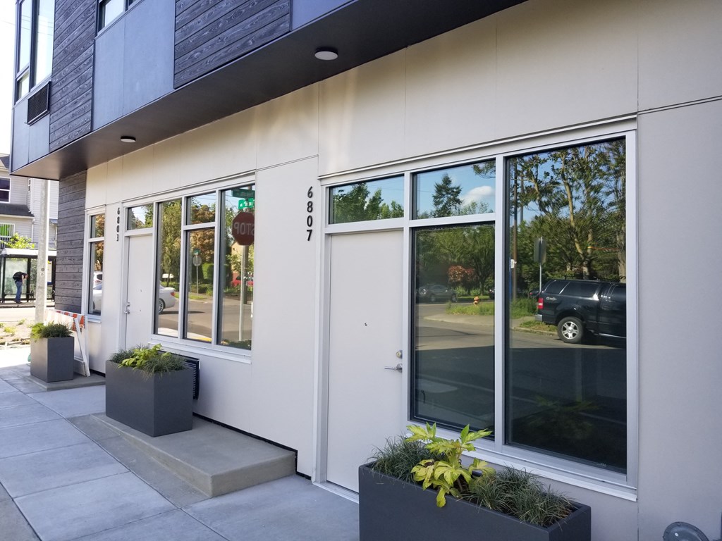 a view of the front of a building with glass doors