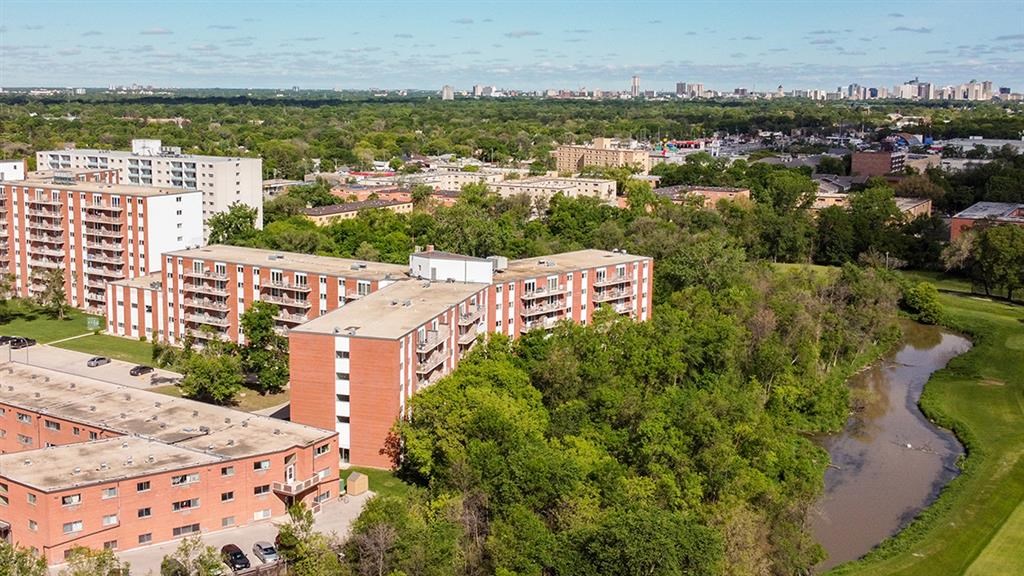an aerial view of a city with buildings and a river