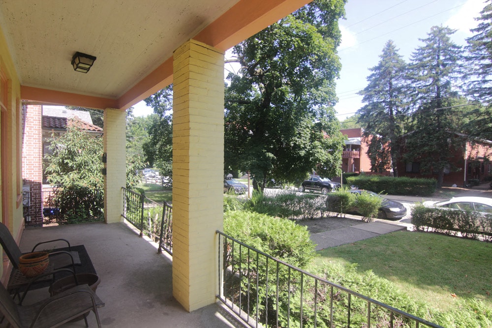 a view of the yard from the porch of a house