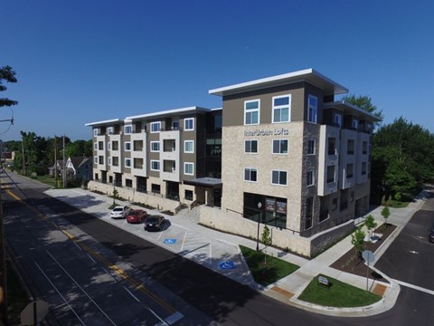 A multi-story building with the words "InterUrban Lofts" on the front.