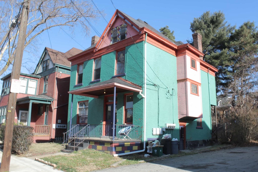 one of several colorful houses in the neighborhood