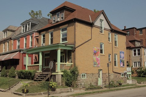 a row of houses on the side of a street