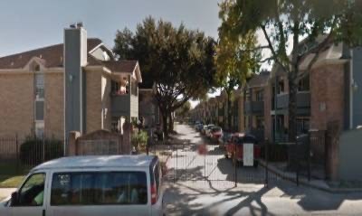 a van is parked on the street in front of houses