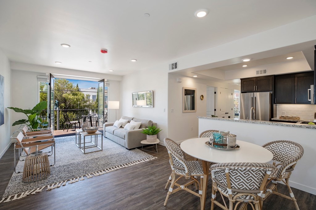 a living room with a round table and a couch