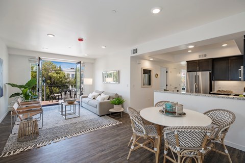 a living room with a round table and a couch