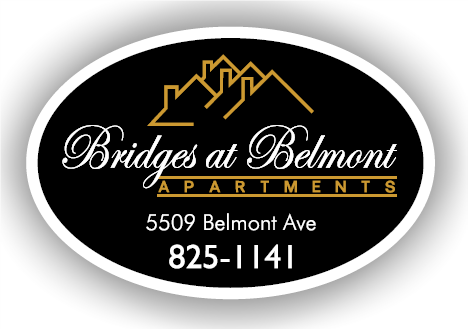 a round black and gold logo with the words bridges at bellmont apartments