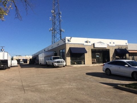 a building with cars parked in front of it