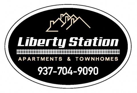 the logo of the liberty station apartments and townhomes logo