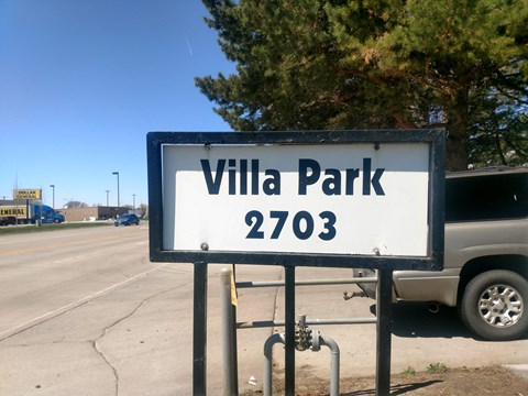 a sign for villa park on the side of the road