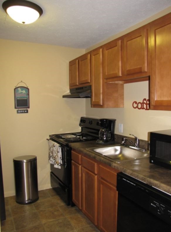 a kitchen with a sink and a stove