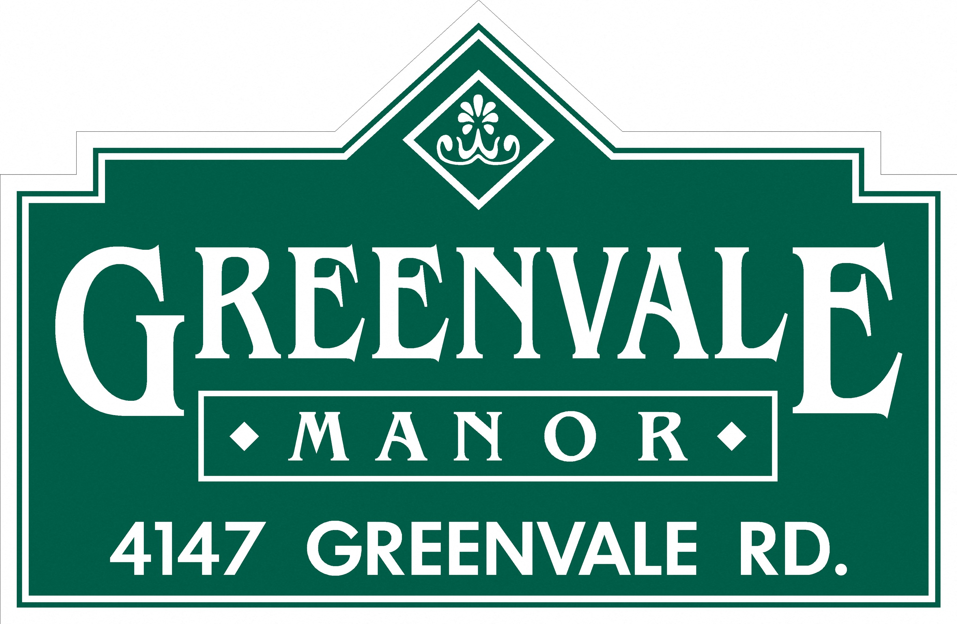 a green sign that reads manor 447 greenvale rd
