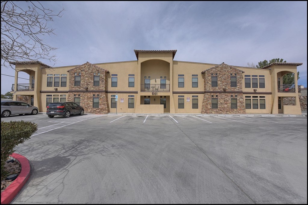 a large building with a parking lot in front of it