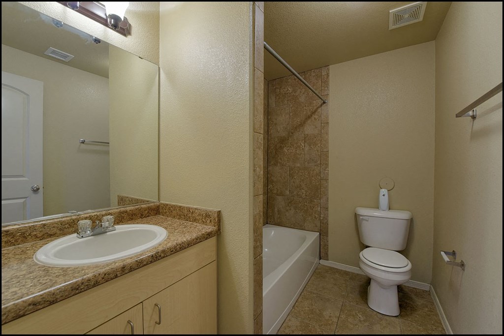 a bathroom with a sink toilet and a shower