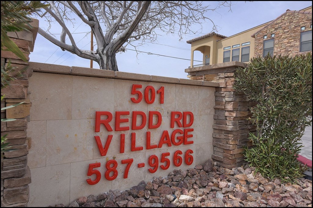 a sign in front of a building