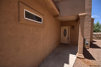 a building with a door and a window on the side of it