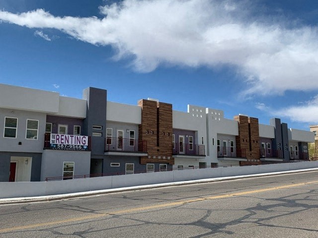 a building with a sign on the side of a street
