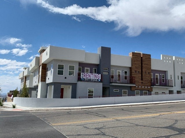 a building with a sign on the side of a street