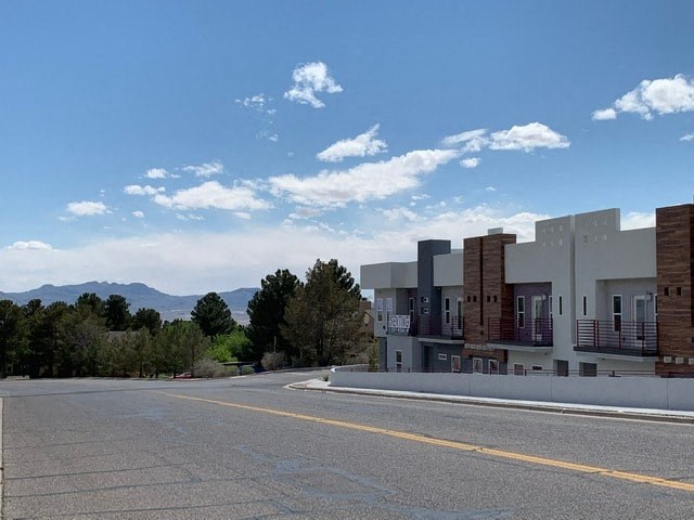 an empty street in front of a building