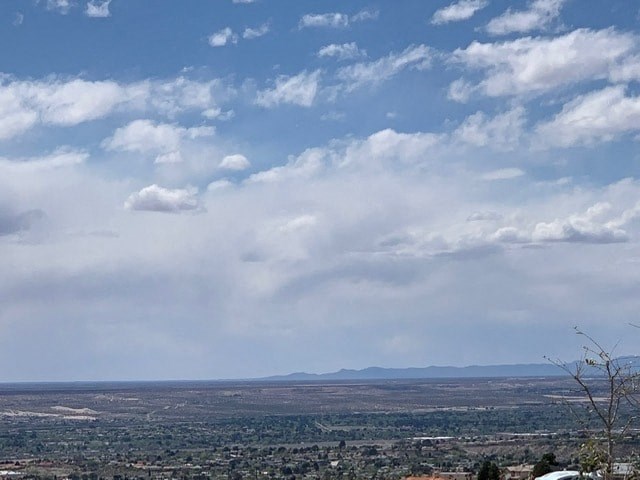 a view of the city and the clouds in the sky