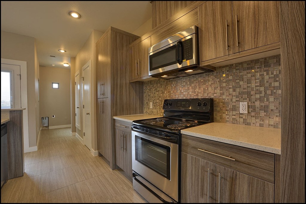a kitchen with a stove and a microwave