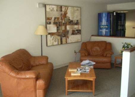 a living room with leather furniture and a coffee table