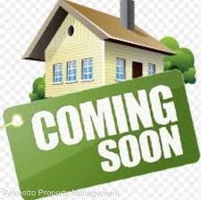 a house with a coming soon sign in front of it