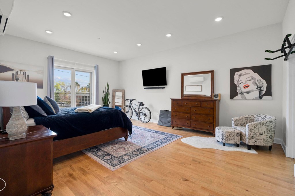 a bedroom with a bed and a tv