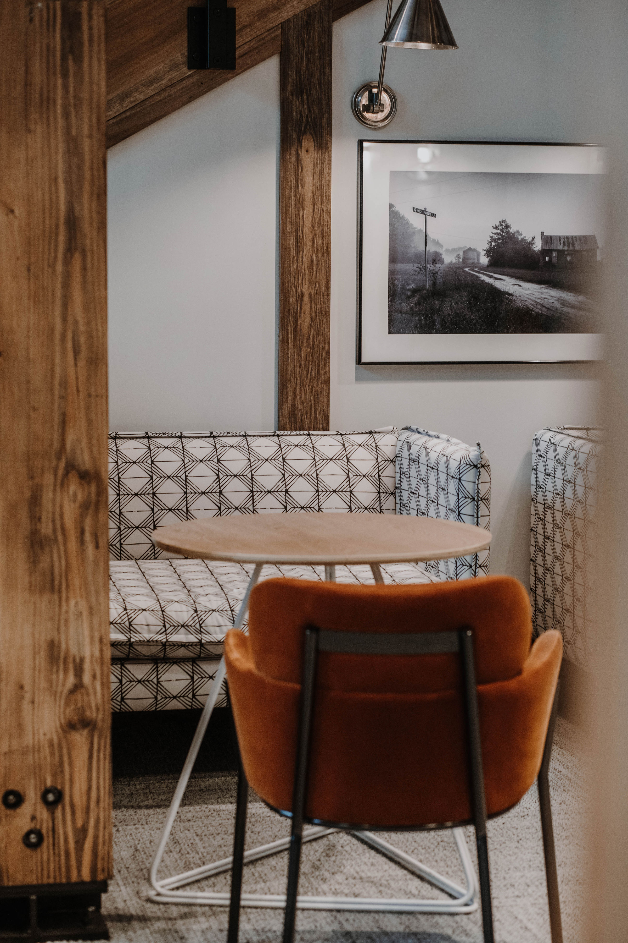 a living room with a table and chair and a couch