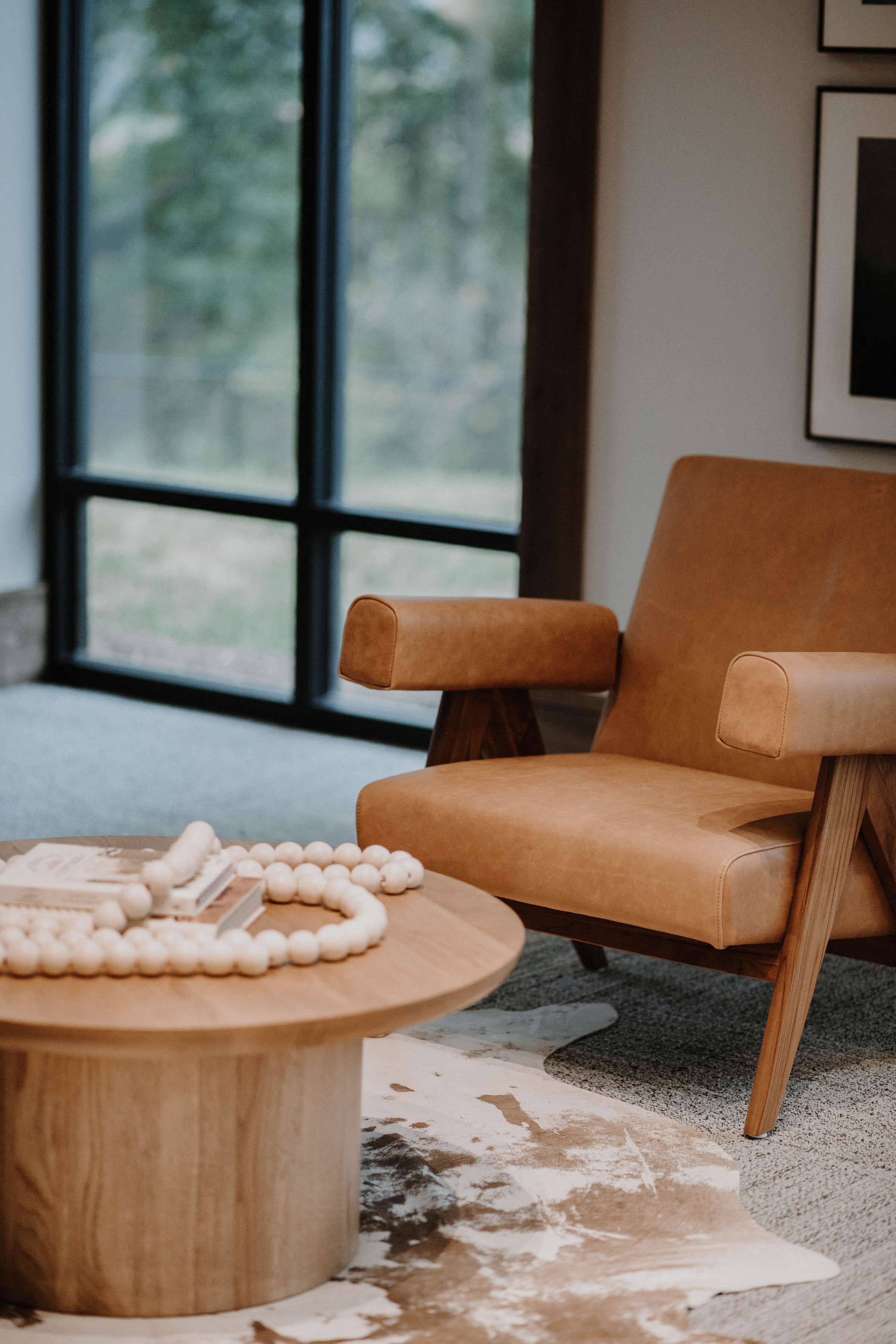 a living room with a chair and a table with balls on it