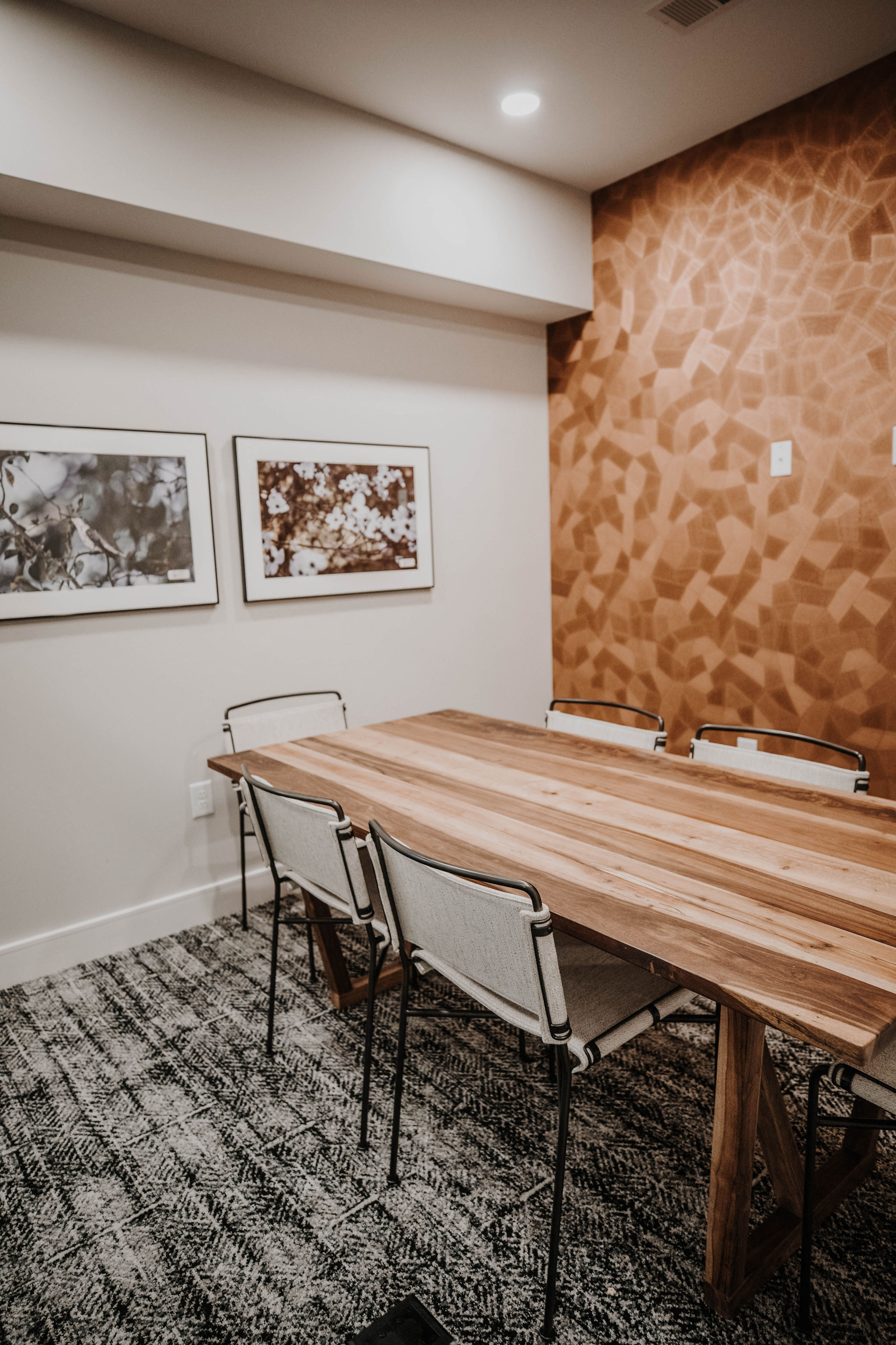 a conference room with a wooden table and chairs