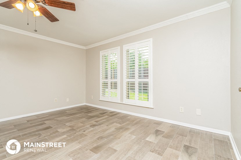 the living room of a new home with a large window